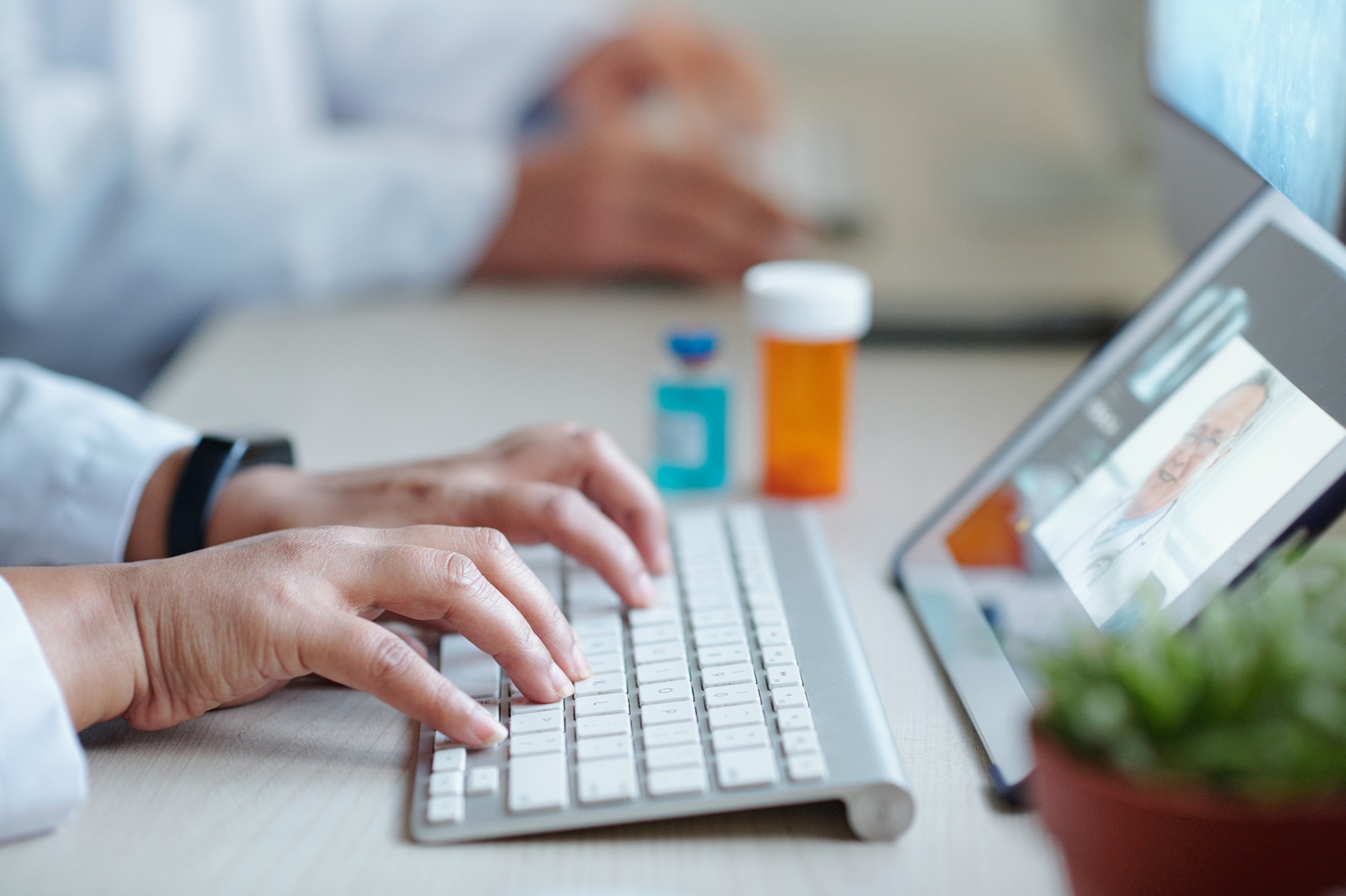 Chief physician working on computer